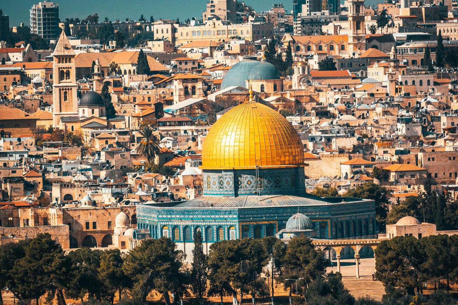 The golden Dome of the Rock rising above the rooftops of the Old City of Jerusalem