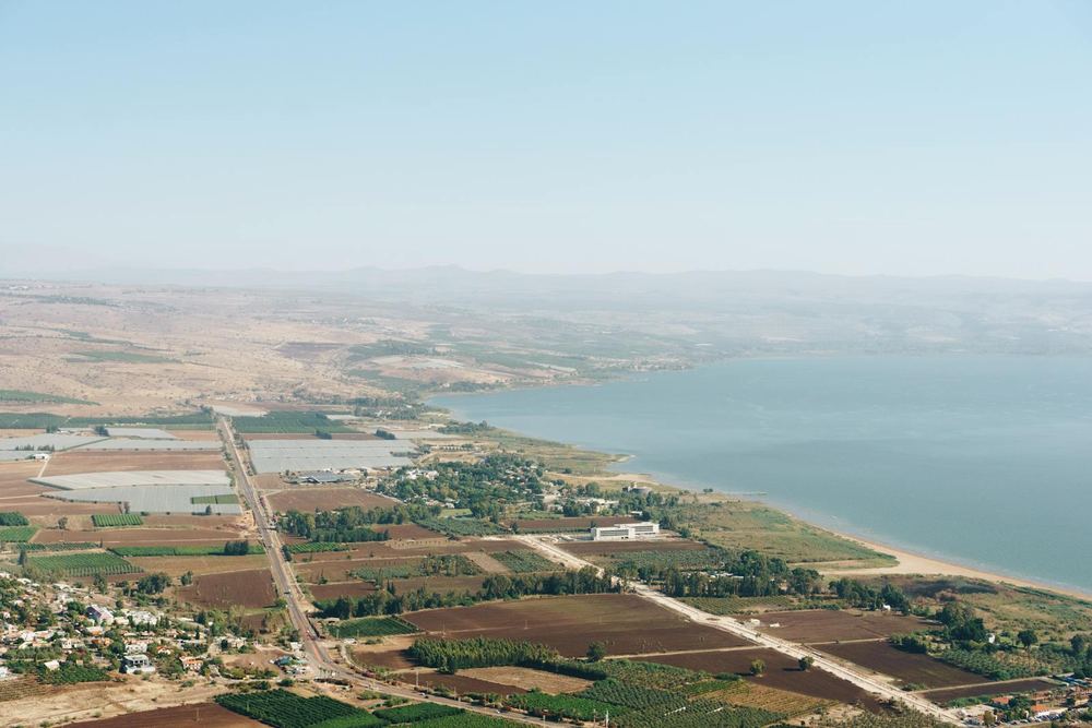 The Sea of Galilee with the green farmland of the Galilee region along its shore
